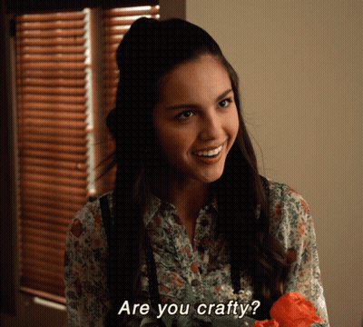 Woman Smiling Holding Flower Saying You Crafty GIF