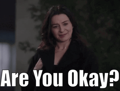 Woman Smiling Holding Paper Saying Are You Okay GIF