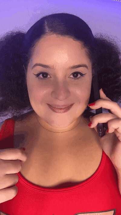Woman Smiling Holding Phone With Red Nails GIF