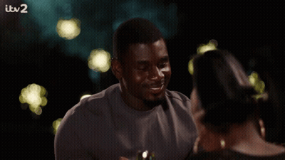 Woman Smiling Holding Wine Glass At ITV2 TV GIF