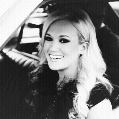 Woman Smiling In Back Seat Of Car GIF