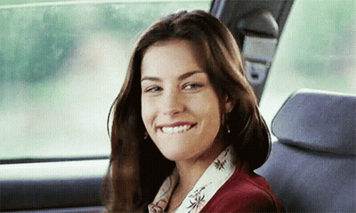 Woman Smiling In Back Seat Of Car GIF