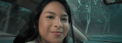 Woman Smiling In Car With Trees GIF