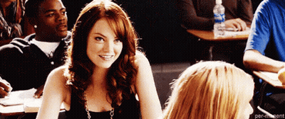 Woman Smiling in Classroom Next to Another Woman