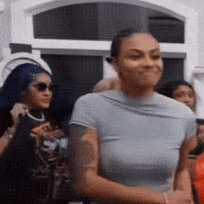 Woman Smiling In Crowd GIF