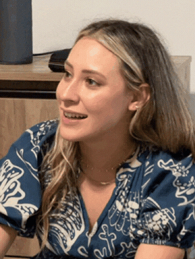 Woman Smiling in Floral Blue and White Shirt