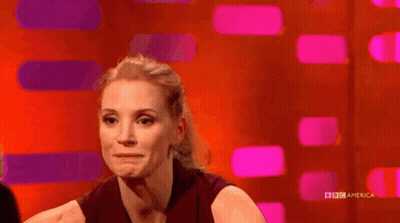 Woman Smiling In Front Of BBC America Screen GIF