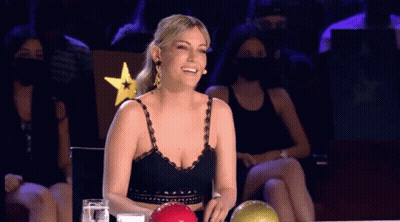 Woman Smiling In Front Of Bowling Ball GIF