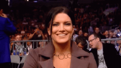 Woman Smiling In Front Of Crowd GIF