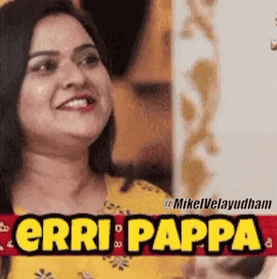 Woman Smiling In Front Of Erri Pappa Sign GIF