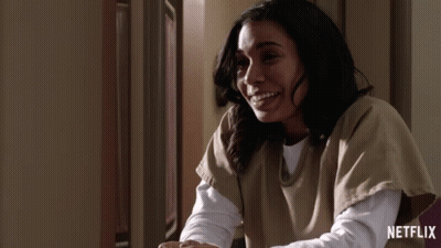 Woman Smiling In Front Of Netflix Ad GIF