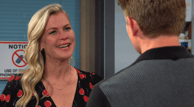 Woman Smiling In Front Of Notice Sign GIF