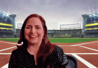 Woman Smiling In Front Of Oakland Baseball Field GIF