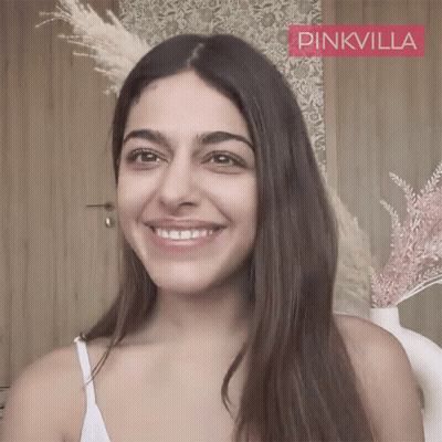 Woman Smiling In Front Of Pinkvilla Logo GIF