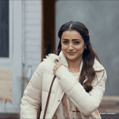 Woman Smiling In Front Of Sony Music Ad GIF