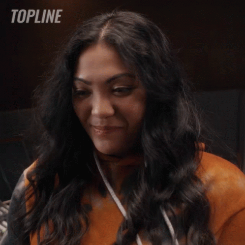 Woman Smiling In Front Of Topline Logo GIF