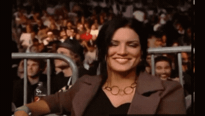 Woman Smiling In Stadium Crowd GIF