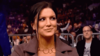 Woman Smiling In Stadium Crowd GIF