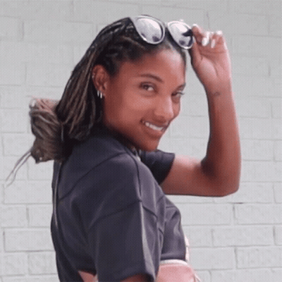 Woman Smiling In Sunglasses And Black Shirt GIF