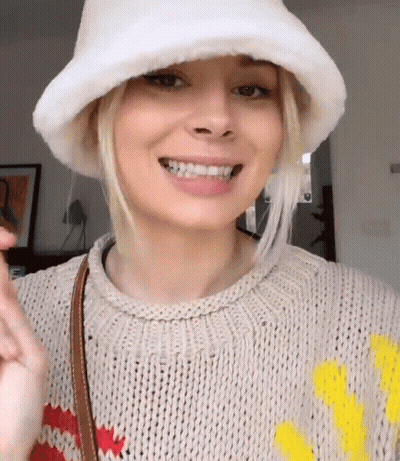 Woman Smiling In Sweater And White Hat GIF