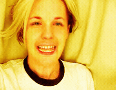 Woman Smiling In White T-Shirt And Black Collar GIF
