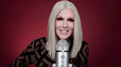 Woman Smiling Into Microphone GIF