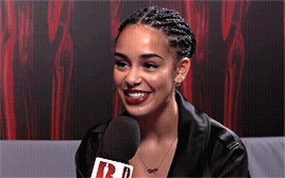 Woman Smiling Into Microphone Saying R GIF