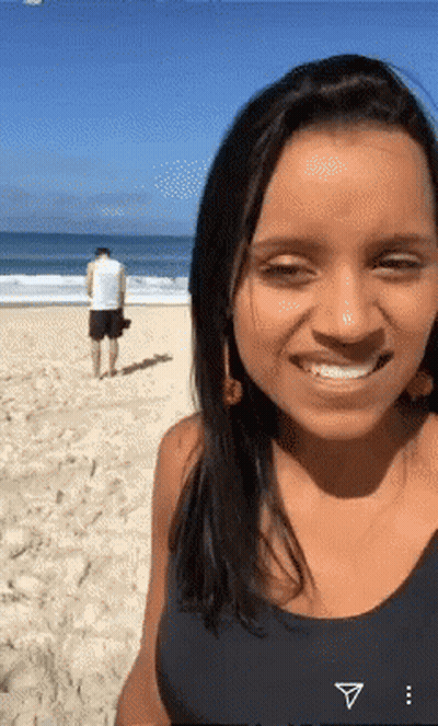 Woman Smiling Man Behind GIF