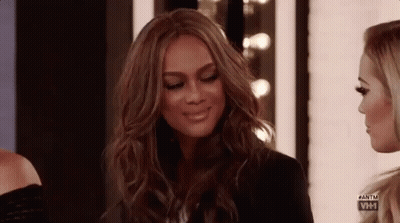 Woman Smiling Next To Another Woman GIF