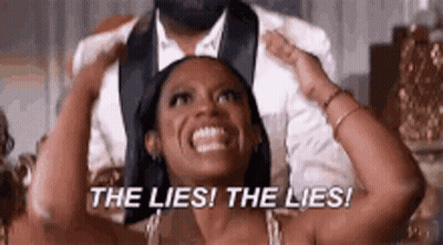 Woman Smiling Next To Man In Tuxedo GIF