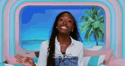 Woman Smiling On Bed By Window With Palm Tree GIF