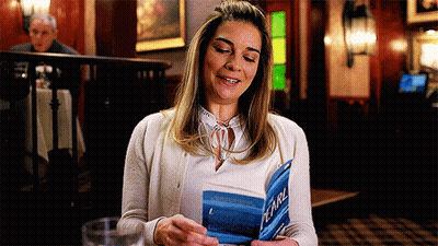 Woman Smiling Reading Pearl Book GIF
