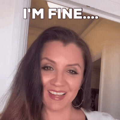 Woman Smiling Saying I'm Fine In Doorway GIF