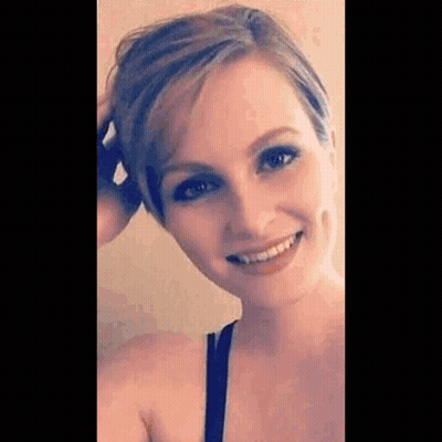 Woman Smiling Touching Hair GIF