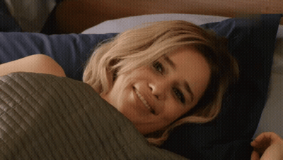Woman Smiling Under Quilt GIF