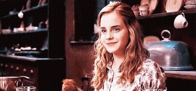 Woman Smiling With Cat On Lap GIF