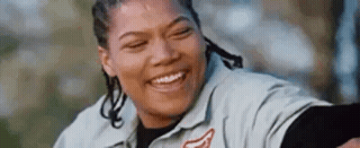 Woman Smiling With Eyes Closed In Gray Shirt GIF