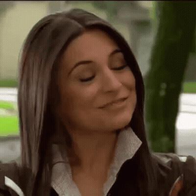 Woman Smiling With Eyes Closed In Leather Jacket GIF