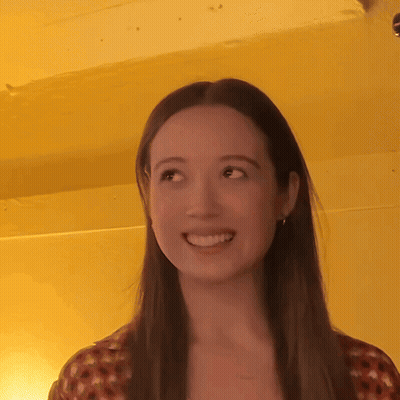 Woman Smiling With Long Hair Yellow Background GIF