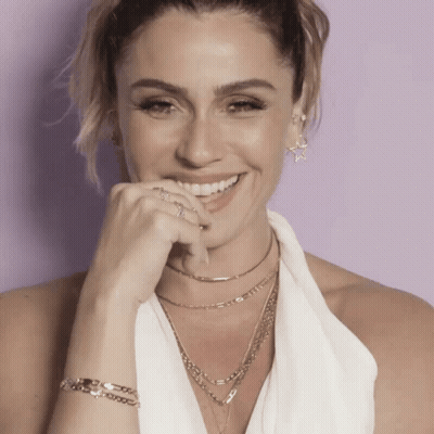 Woman Smiling With Necklace And Bracelet GIF