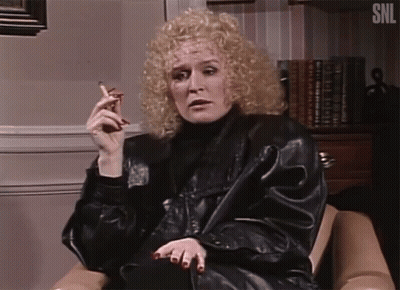 Woman Smoking Cigar In Chair SNL GIF