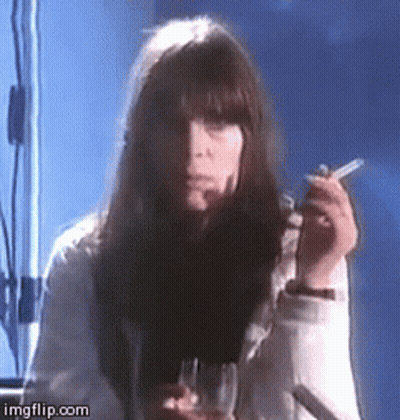 Woman Smoking Cigarette And Holding Wine GIF