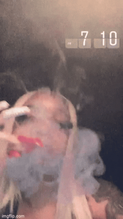 Woman Smoking Cigarette Clock 7:10 PM GIF