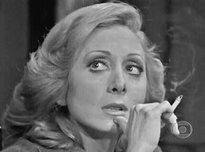 Woman Smoking Cigarette In Black And White GIF