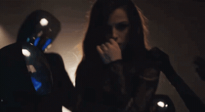Woman Smoking Cigarette In Dark Room With Man GIF