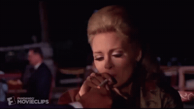 Woman Smoking Cigarette In Dark Room With Ring GIF