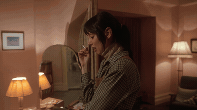 Woman Smoking Cigarette In Mirror GIF
