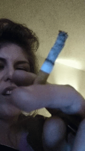 Woman Smoking Cigarette With Blue Label GIF