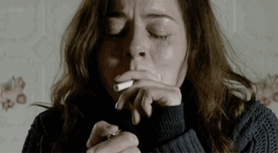 Woman Smoking Cigarette With Eyes Closed GIF