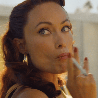 Woman Smoking Cigarette With Eyes Closed GIF